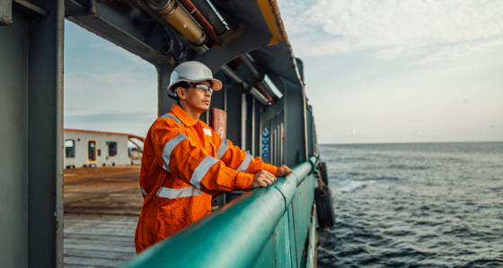 Worker looking towards the sea