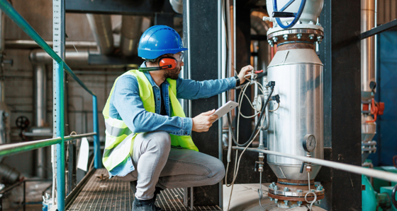 Engineer inspecting machinery