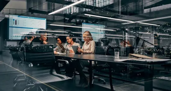 Team working in front of laptops