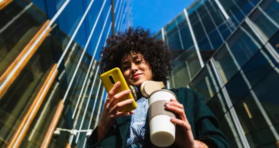 Lady smiling at her mobile phone