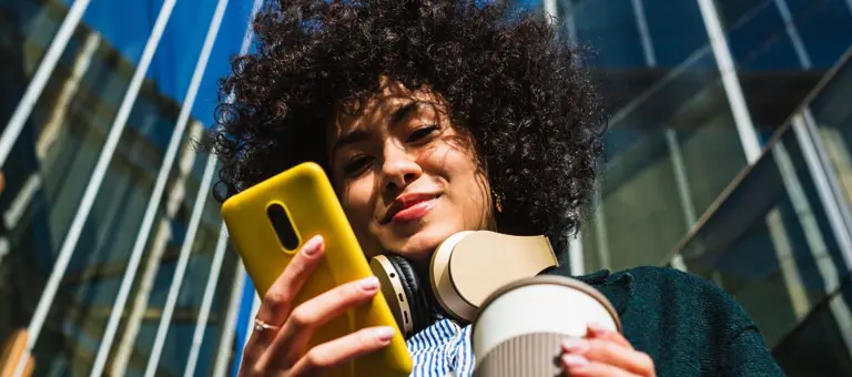 Lady smiling at her mobile phone