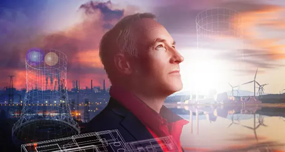 Picture showing coal plants on the left and wind farms on the right with a man looking ahead