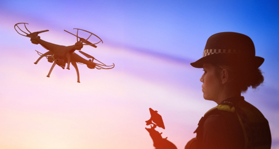 British police office operating a drone
