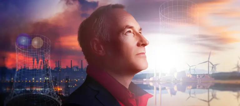 Picture showing coal plants on the left and wind farms on the right with a man looking ahead