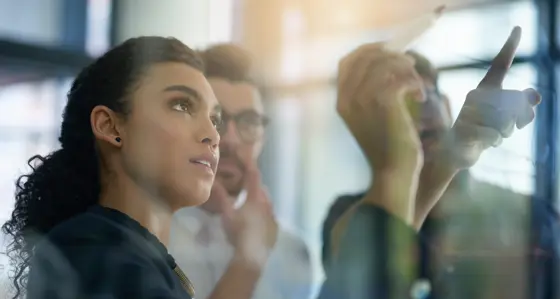 People looking at whiteboard