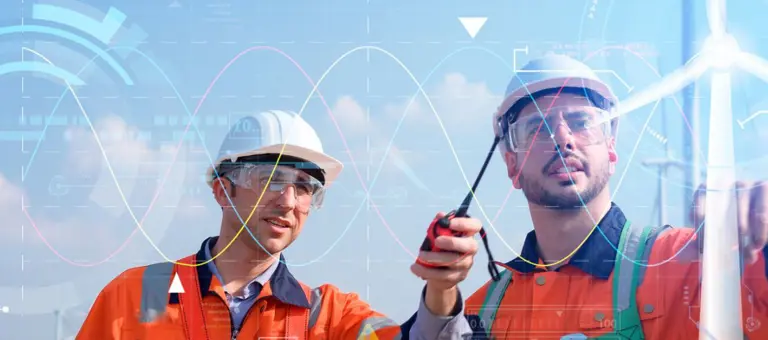 Men looking a tech for a wind turbine