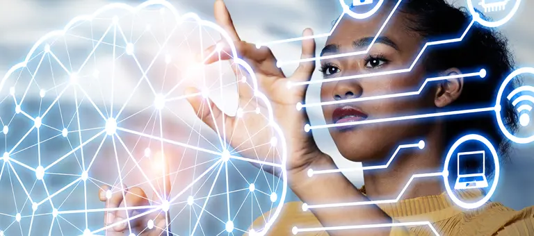 A woman touching holographic image of brain surrounded by icons