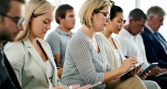 Group of professionals taking notes
