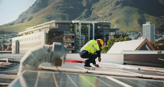 Worker on a solar panel