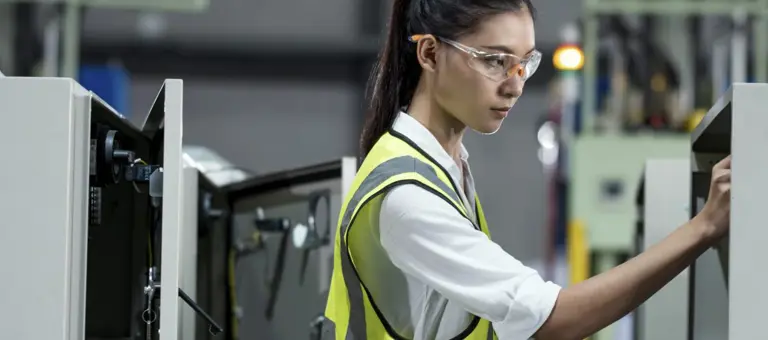 A woman carrying out equipment maintenance