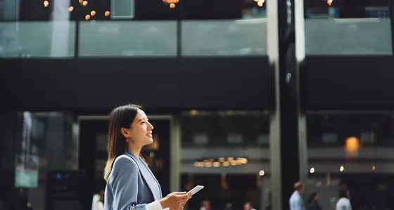 Woman walking with a smartphone