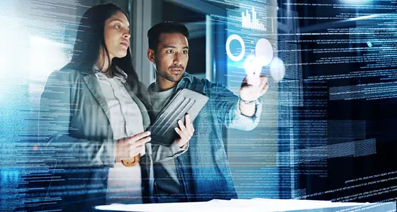 Two colleagues looking at a screen