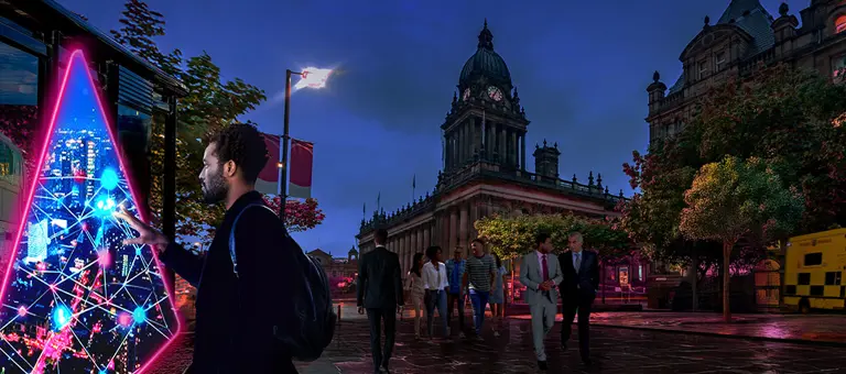 Man standing in public square looking into portal in front of bus stop