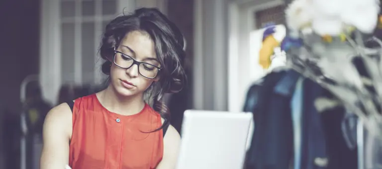 Woman working at a desk in her home