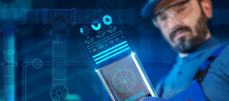 An engineer looking at data on a screen