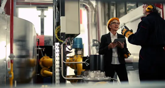 A woman and a man in a factory