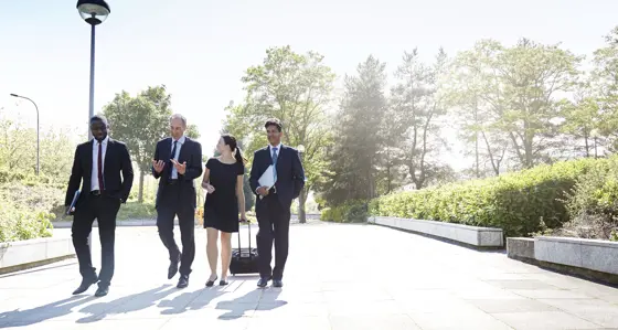business people walking outdoors