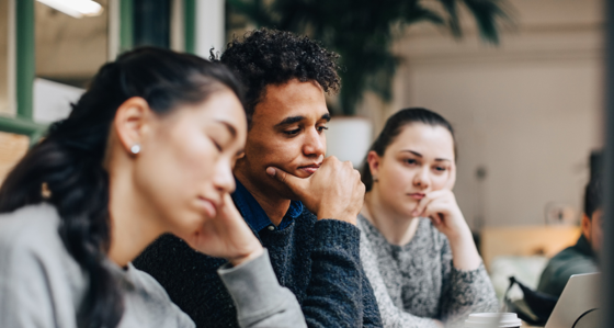 business colleagues sitting at desk in office