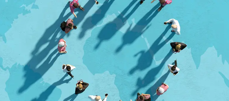 Digital generated image of multi racial group of people forming circle on world map